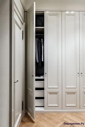 Design of a built-in hallway with hinged doors photo