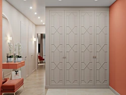 Design of a built-in hallway with hinged doors photo