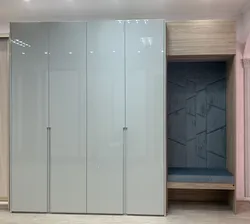 Wardrobe design for the hallway with hinged doors in a modern style