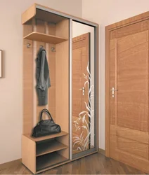 Wardrobe in the hallway with shoe rack and hanger photo