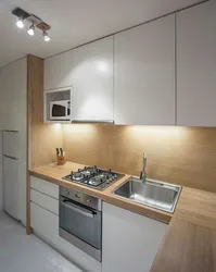 Sink and stove next to each other in the kitchen photo