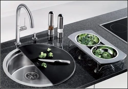 Sink and stove next to each other in the kitchen photo