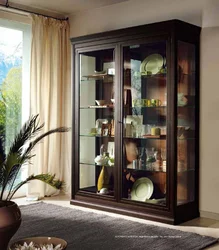 Cabinet in the living room for dishes with glass in a modern style photo