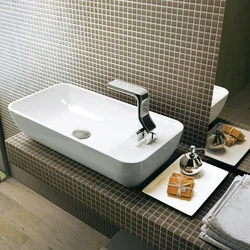 Bathroom sink overlay on the countertop photo of the bathtub