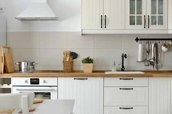 White kitchen black appliances photo wooden countertop