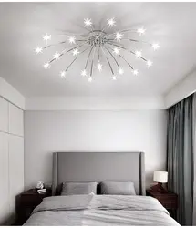 Modern chandelier under a suspended ceiling in the bedroom photo
