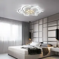 Modern chandelier under a suspended ceiling in the bedroom photo