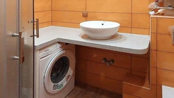 Bathroom countertop for washing machine and sink photo