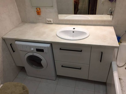 Bathroom countertop for washing machine and sink photo