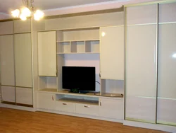 Wardrobe design in the living room with TV