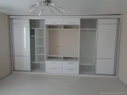 Full-wall bedroom wardrobe design with TV