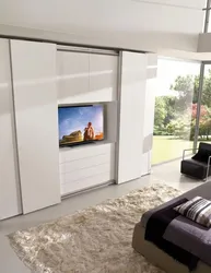 Full-Wall Bedroom Wardrobe Design With TV
