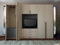 Modern wardrobes with TV in the bedroom photo