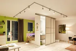 Track lights on a suspended ceiling in the living room photo
