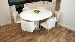 Table on one leg in the kitchen interior