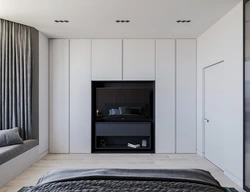 Wardrobe with TV in bedroom interior