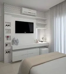 Wardrobe With TV In Bedroom Interior