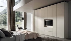 Wardrobe with TV in bedroom interior