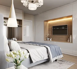 Wardrobe with TV in bedroom interior