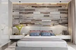 Modern bedroom interior with laminate flooring on the wall