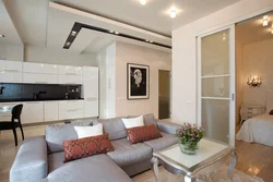 Interior of a one-room apartment with a kitchen and living room