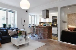 Interior of a one-room apartment with a kitchen and living room