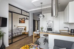 Interior of a one-room apartment with a kitchen and living room