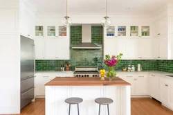 Kitchen with green tile splashback design