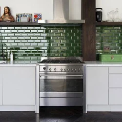 Kitchen with green tile splashback design