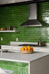 Kitchen with green tile splashback design