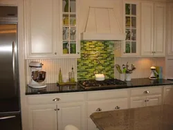Kitchen with green tile splashback design