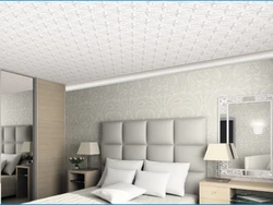Ceiling tiles in the bathtub on the walls photo