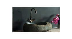 Stone sink in the bath photo