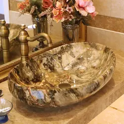 Stone sink in the bath photo