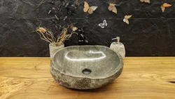 Stone sink in the bath photo