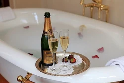 Glass of champagne photo in the bath