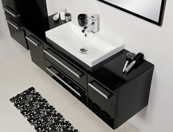 Black sink in the bathroom in the interior