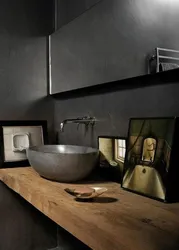 Black sink in the bathroom in the interior