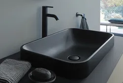 Black sink in the bathroom in the interior
