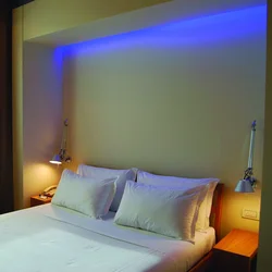 Light above the bed in the bedroom photo