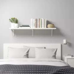 Shelves on the wall in the bedroom interior