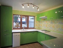Kitchen design with green wallpaper