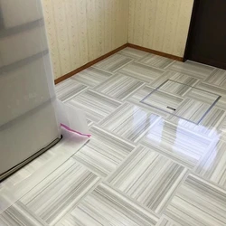 Laminate flooring in the kitchen and hallway photo