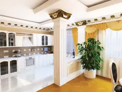 Columns in the interior of a living room with a kitchen