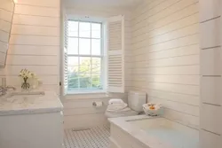 Bathtub with PVC wood panels photo