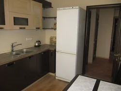 Corner kitchen design with refrigerator by the door