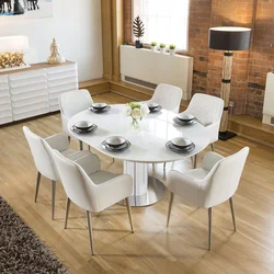 Table and chairs in the living room in a modern style photo