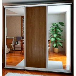 Bedroom wardrobe with mirror for three doors photo