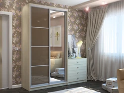 Bedroom wardrobe with mirror for three doors photo