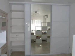 Bedroom wardrobe with mirror for three doors photo